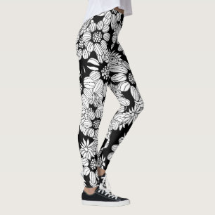 Weiße Blumen auf einem schwarzen Hintergrund Leggings