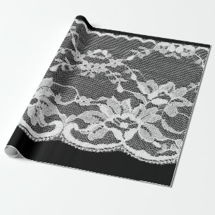 Weiße Blumenspitze auf schwarzem Hintergrund. Geschenkpapier