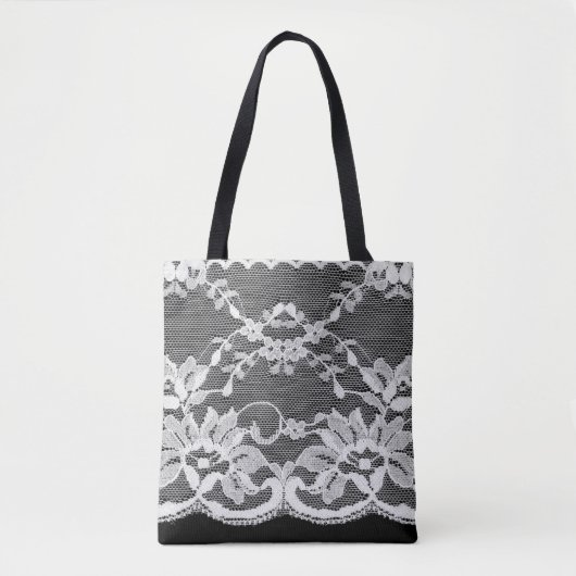 Weiße Blumenspitze auf schwarzem Hintergrund. Tasche (Vorderseite)