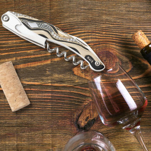 Weiße Diamanten und goldene Zebrastreifen auf schw Kellnermesser