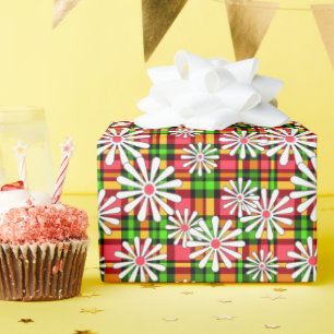 Weiße dunkle Blume auf einem roten, grünen Rücken Geschenkpapier