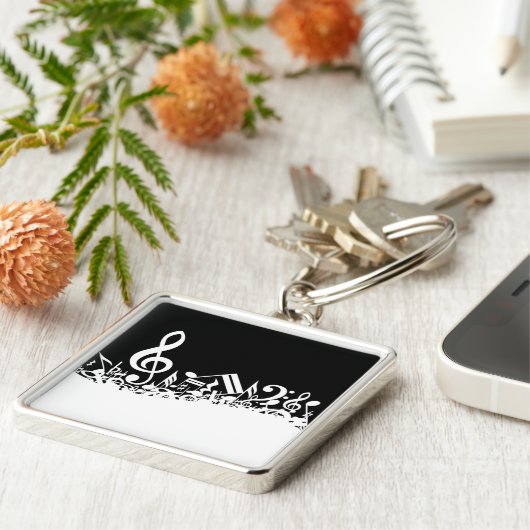 Weiße durcheinandergebrachte musikalische schlüsselanhänger (Seite)