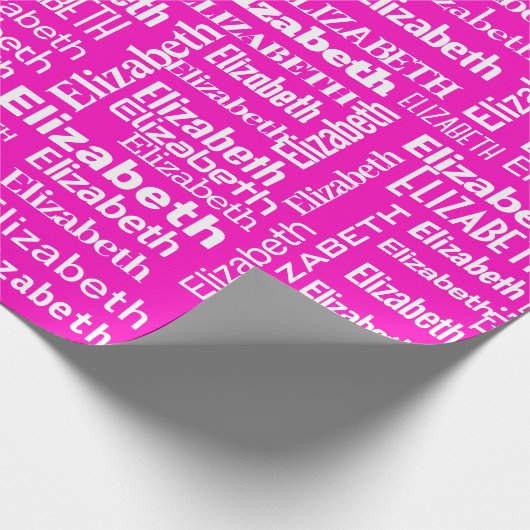 Weiße ELIZABETH-Bezeichnung auf rosa Geschenkpapier (Ecke)
