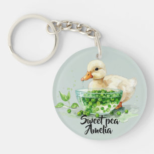 Weiße Ente ißt Erbsen aus Schale  Schlüsselanhänger