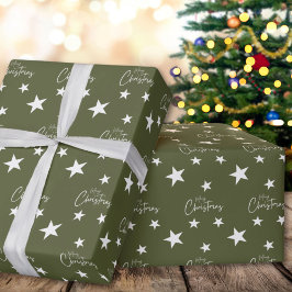 Weiße frohe Weihnachtsstars auf Grün Geschenkpapier