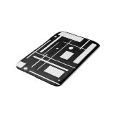 Weiße geometrische Formen auf der Schwarzmatte Badematte (Schrägansicht)