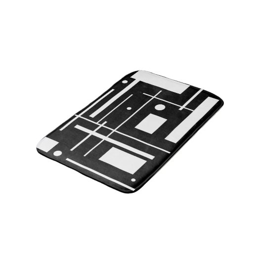Weiße geometrische Formen auf der Schwarzmatte Badematte (Schrägansicht)