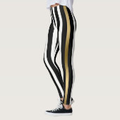 Weiße, goldene und schwarze Streifen Leggings (Links)