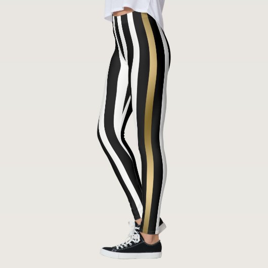 Weiße, goldene und schwarze Streifen Leggings (Links)