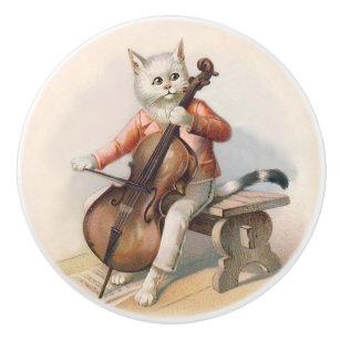 Weiße Katze, die Cello-dekorativen Griff spielt