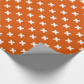 Weiße Kreuzstiche auf verbranntem Orange Geschenkpapier (Ecke)