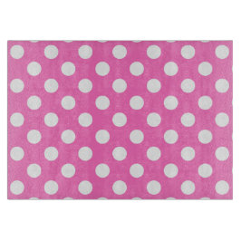 Weiße Polka-Punkte auf rosa Schneidebrett