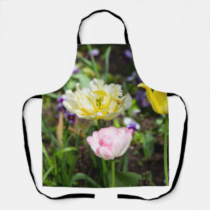 Weiße, rosa und gelbe Tulpen im Garten Schürze