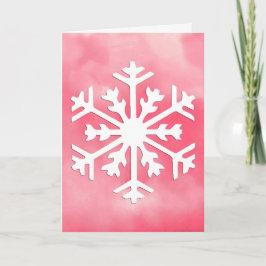 Weiße Schneeflocke auf rosa Aquarellfarbe Hintergr Feiertagskarte