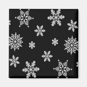 Weiße Schneeflocke mit schwarzem Hintergrund Kühls Magnet