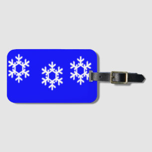 Weiße Schneeflocken auf blau Gepäckanhänger