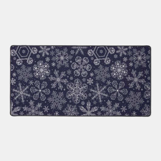 Weiße Schneeflocken auf blau Schreibtischunterlage (Vorderseite)
