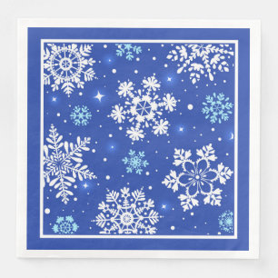 Weiße Schneeflocken auf blau Serviette
