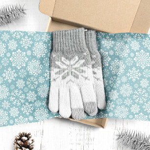 Weiße Schneeflocken auf blauem Weihnachten Seidenpapier