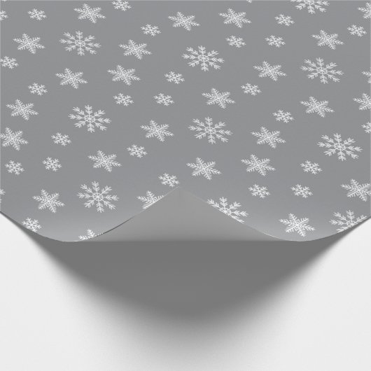 weiße Schneeflocken auf grauem Hintergrund Geschenkpapier (Ecke)