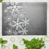 Weiße Schneeflocken auf grauem Küchentuch (Gefaltet)