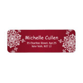 Weiße Schneeflocken auf roten Weihnachtsadressen (Vorne)