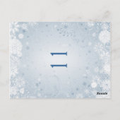 Weiße Schneeflocken auf silberblauer Tischnummer (Rückseite)