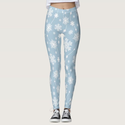 Weiße Schneeflocken im hellblauen Hintergrund Wint Leggings (Vorderseite)