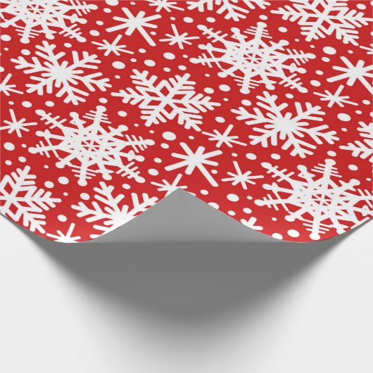 Weiße Schneeflocken in Rot Geschenkpapier (Ecke)