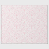 Weiße Spitze auf rosa Geschenkpapier (Flach)