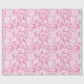 Weiße Spitze auf rosa Geschenkpapier (Flach)