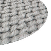 Weiße Strickwollestruktur, nahes Foto. Schneidebrett (Ecke)