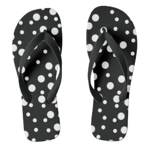 Weiße Tupfen auf schwarzen Flipflops Badesandalen
