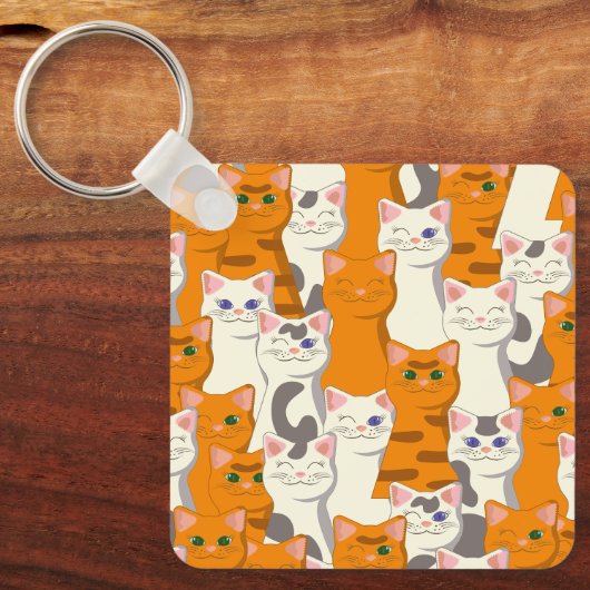 Weiße und Ingwer Katzen Muster grüne Augen blaue A Schlüsselanhänger (Vorderseite)