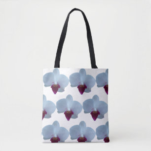 Weiße und lila Orchideen auf einer Tasche mit Groß