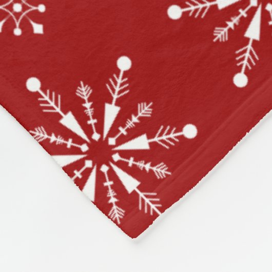 Weiße und rote Weihnachtsschneeflocken Fleecedecke (Ecke)