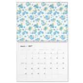 weißer Hintergrund mit blauen Blumen und grünem Le Kalender (Mär 2027)