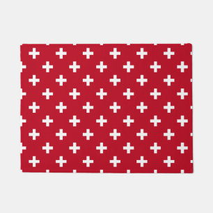 Weißer Polka kreuzt auf rot Fußmatte