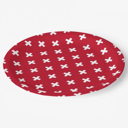 Weißer Polka kreuzt auf rot Pappteller (Schrägansicht)