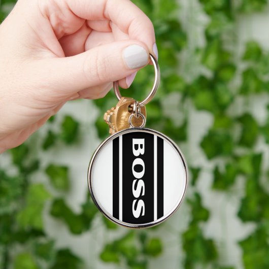 Weißer schwarzer laufender schlüsselanhänger (Hand)