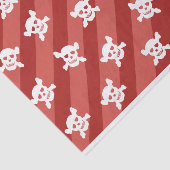 Weißer Totenkopf mit gekreuzter Knochen auf roten Seidenpapier (Ausschnitt)