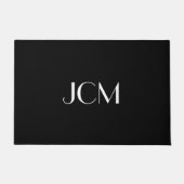 Weißes Anfangsmonogramm auf schwarz Fußmatte (Vorderseite)