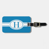 Weißes Band und ovales Schild mit Monogramm auf bl Gepäckanhänger (Vorderseite horizontal)