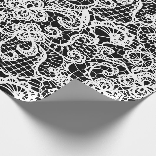 Weißes Blatt auf schwarzem Papier Geschenkpapier (Ecke)