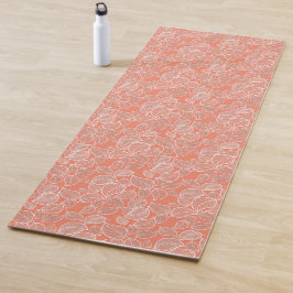 Weißes Blätter auf Orange Yogamatte