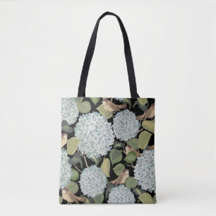 Weißes, hellblaues Hortensia mit grünen Blätter un Tasche