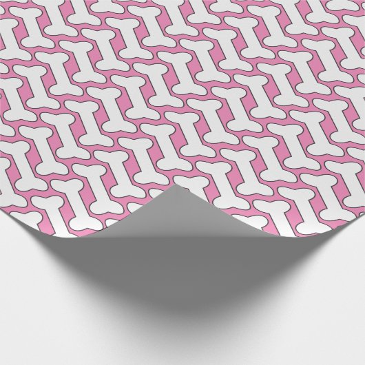 Weißes Knochenmuster auf rosa Farbe Geschenkpapier (Ecke)