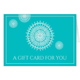 Weißes Mandala-Symbol des Universums auf Türkis