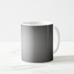 Weißes Rampenlicht auf schwarz Kaffeetasse
