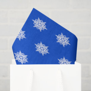 Weißes Schneeflockenmuster auf Blau Seidenpapier